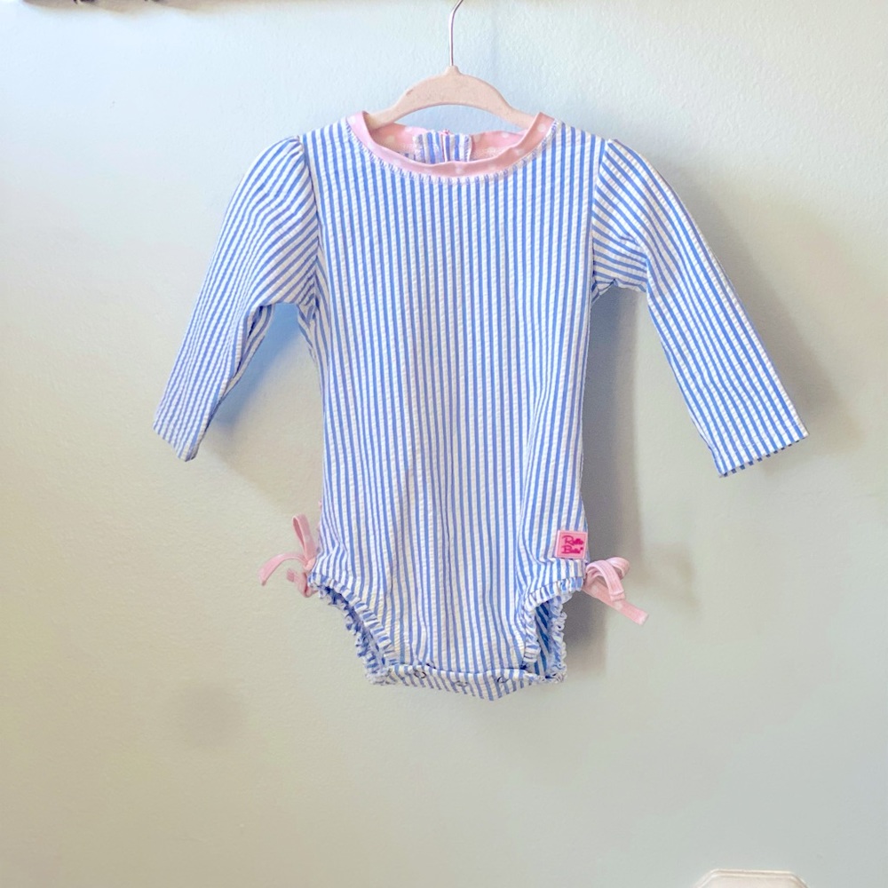 Pink and blue striped long sleeve swimsuit